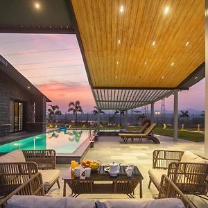 Stayvista'S Le Ciel - Lakeside Retreat Amidst Farmland With Pool, Indoor Activities, Lawn, Bonfire Pit & Ample Seating Space Wadhiware Exterior photo